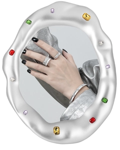Close-up of matte S925 silver bangles and rings with stars diamond texture details