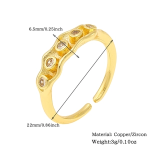 Detailed view of copper ring with 18K gold finish and champagne zircon inlays