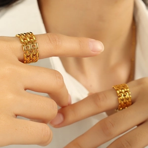 Vintage hollow woven 18k gold plated stainless steel ring shown on model finger