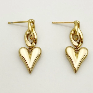 Golden heart drop earrings featuring bold stainless steel chain link design on white background