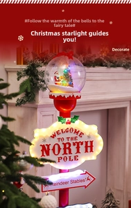 Detail of light-up Christmas road sign with Santa globe and North Pole text