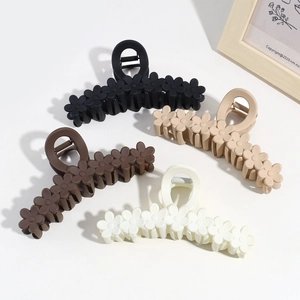 Minimalist large flower hair claw clips in four colors with matte floral design