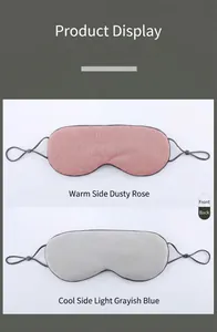 Dual-sided sleep mask detail showing breathable pink warm side and blue cool silk surface