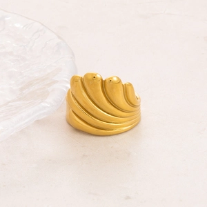 Detailed view of irregular hammer textured ring with 18K gold plating and shell design