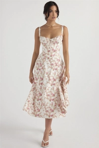 Detail of floral midi dress with pink rose print, corset bodice, and lace-up front design