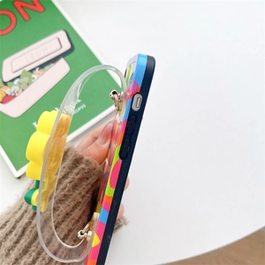 Detail of blue phone case with colorful dots and a floral transparent wrist strap