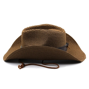 Detail of dark brown woven straw cowboy hat with leather band and adjustable chin strap