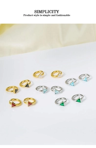 Detailed view of geometric triangle zircon hoop earrings in gold and silver finishes