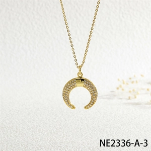 Detailed close-up of a crescent horn pendant necklace with sparkling micro-pave cubic zirconia