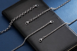 Detailed comparison of four stainless steel pearl chain bracelets with lobster clasps