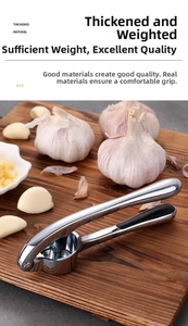 Manual zinc alloy garlic press with thickened handle and non-slip black grip details