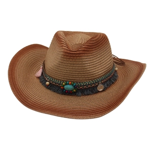 Ethnic Western straw cowboy hat with bohemian tassels, turquoise beads and coins