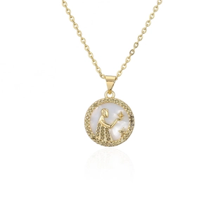 Close-up of gold plated zodiac necklace featuring white mother of pearl and pavé crystals