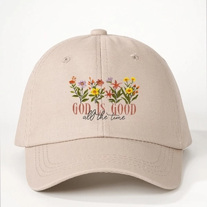 Adjustable beige baseball cap with floral print and God Is Good embroidery design