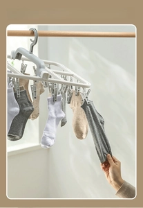 Close-up of durable sock drying rack with strong non-slip clips holding multiple cotton socks