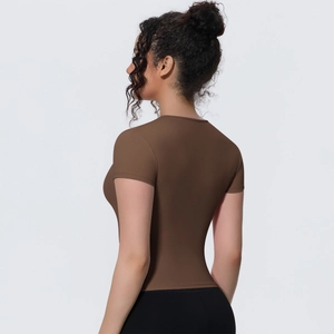 Rear view of tight dark brown yoga t-shirt showing slim fit cut and elastic sport fabric