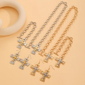 Textured cross necklace bracelet and earrings set in silver and gold tones