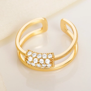 Golden double layer open ring featuring rectangular pavé white zircons and beaded texture