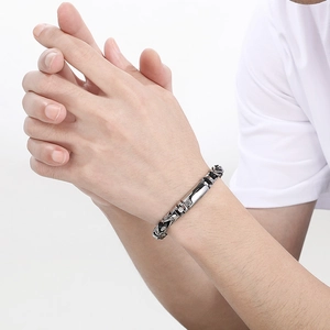 Men's retro 18k plated titanium steel bracelet with vintage pattern on model wrist