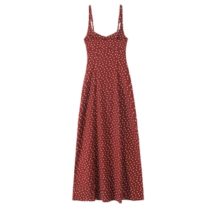 Elegant deep red polka dot midi dress with spaghetti straps and a side slit for summer