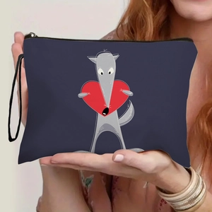 Navy blue canvas makeup bag with cartoon wolf and heart print held by hands