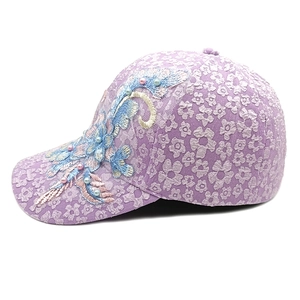 Close-up of floral lace baseball cap with intricate flower embroidery and pearl accents