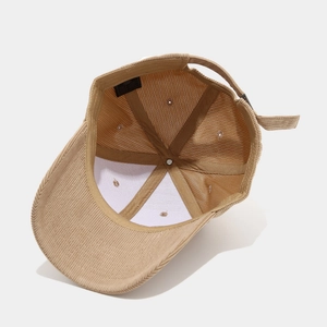 Detailed view of the khaki corduroy baseball cap interior with reinforced stitching