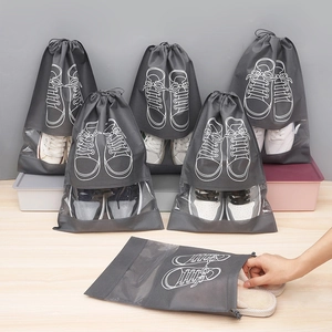 Gray drawstring shoe storage bag with clear window for travel and dustproof home organization