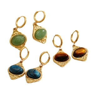 Three pairs of vintage oval tiger eye and gemstone hoop earrings in gold plated finish