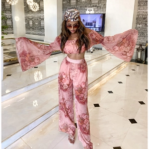 Summer pink floral two-piece set with off-shoulder crop top and wide-leg trousers