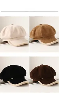 Detail of faux suede newsboy hats with plush trim and metallic accents in four colors