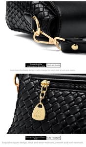 Detail of woven black leather with detachable gold-tone hook and logo zipper puller