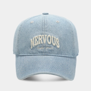 Close-up of vintage light blue washed denim cap with Nervous 3D letter embroidery