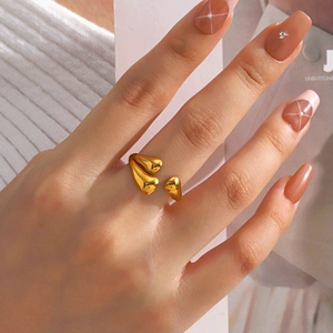 Minimalist gold teardrop open ring with organic organic shape and polished metal finish