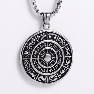 Macro shot of vintage Viking sun pendant with intricate rune carvings and silver finish