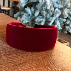 Close-up of red velvet padded wide headband with anti-slip inner lining for winter