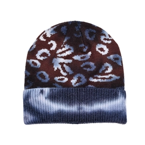 Detailed macro view of the knitted texture with leopard print and tie-dye ribbed cuff