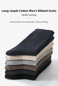 Detail showing various colors of ribbed cotton middle stockings for men in a neat stack