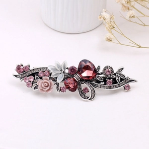 Pince à cheveux vintage fleurie avec cristaux roses et violets sur métal argenté