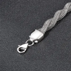 Macro detail of stainless steel snake chain weave texture with sturdy lobster clasp