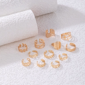 11-piece set of gold-tone bohemian rings with leaf, moon, heart, and eye motifs