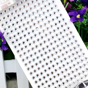 Close-up of 3mm transparent acrylic rhinestone stickers in grid layout for DIY crafts