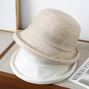 Minimalist Japanese style bucket hat set in beige and white with ripple textured fabric