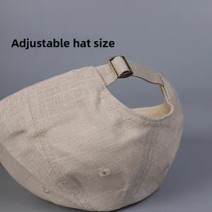 Close-up of linen baseball cap back with adjustable vintage bronze metal buckle strap