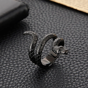 Macro detail of punk cobra snake ring showing intricate scales on black leather