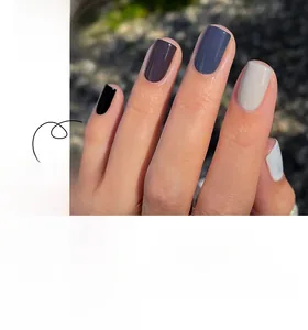 Short square press-on nails in minimalist solid shades of grey, black, and white