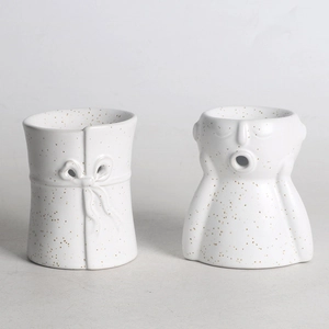 Abstract white ceramic aromatherapy burner set with gold dots and bust sculpture design
