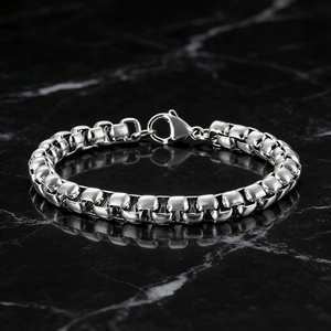 Men's minimalist silver stainless steel box chain bracelet with lobster clasp on marble