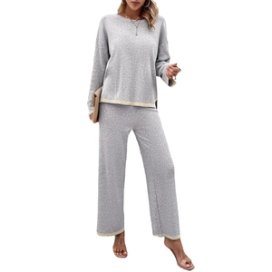 Women's grey knit lounge set with yellow contrast stripes on long sleeve top and pants