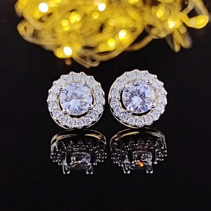 Silver stud earrings with round clear zircon center and halo of small crystals